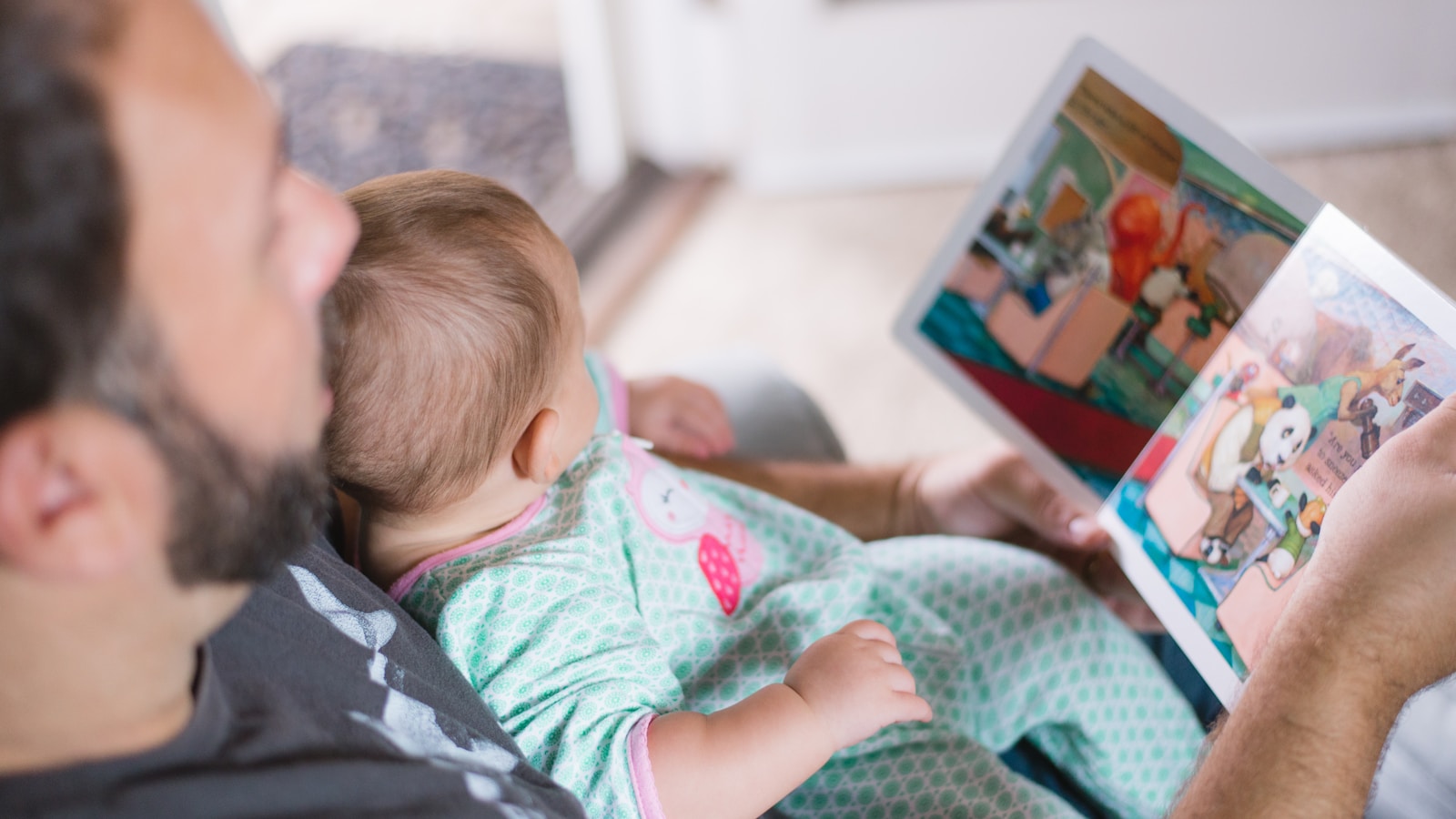 Parent reading to a young child