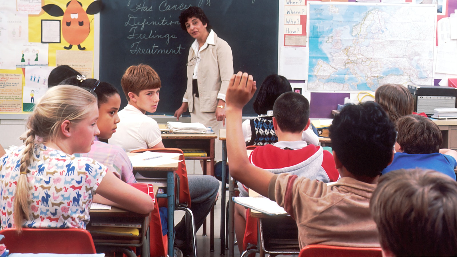 Teacher using puppets to interact with children
